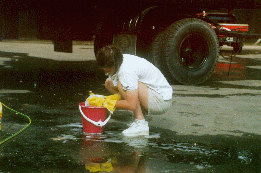 02 - Stephanie washing parts of the water truck