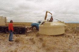 1.33 - Unloading tanks from the big truck in the pampa