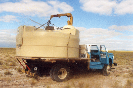 1.35 - Loading one tank on the small truck in the pampa